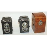 Voightlander Brilliant Bakelite bodied cameras, one in original leather case, serial nos. 3902358