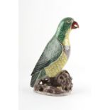 A Chinese famille verte model of a parrot, Kangxi period (1662-1722), 8.5ins. (21.5cms.) high.
