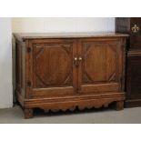 Property of a lady - an oak two-door cupboard, 18th century & later adapted, 52ins. (132cms.) wide.