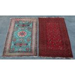 Property of a lady - a Turkoman rug with pale blue ground, 84 by 55ins. (213 by 140cms.); together