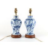 Property of a lady - a pair of Chinese Kangxi period blue & white baluster vases, adapted as table