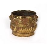 Property of a lady - a 19th century embossed brass log bin, with lion mask handles, 17ins. (