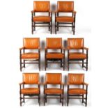 Property of a gentleman - a set of eight oak & tan leather upholstered open armchairs (8).