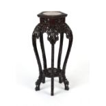 Property of a lady - a Chinese carved hardwood hexagonal plant stand, with marble inset top, 31.