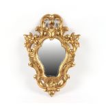 Property of a gentleman - an early 20th century Florentine carved giltwood framed wall mirror, 21.