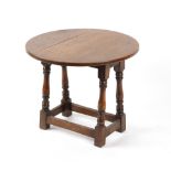 Property of a deceased estate - a reproduction oak circular topped drop-leaf occasional table, 23.