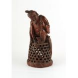 A late 19th / early 20th century carved bamboo figure of a fisherman, 10.25ins. (26cms.) high.