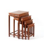 Property of a lady - a nest of four Chinese carved hardwood occasional tables, the largest 20ins. (