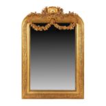 Property of a gentleman - a Victorian gilt arched framed overmantel mirror with shell & trailing