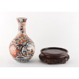 Property of a gentleman - a 19th century Japanese Imari bottle vase, 9.1ins. (23.1cms.) high;