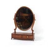 Property of a deceased estate - a mahogany oval swing-frame toilet mirror with bow-fronted two-