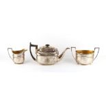 Property of a lady - a George III silver teapot and similar sugar basin with matching milk jug,