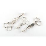 Property of a gentleman - three pairs of Georgian silver scissor action sugar tongs, the largest