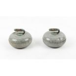 Property of a deceased estate - a pair of late 19th / early 20th century curling stones, one handle