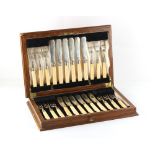 Property of a deceased estate - an early 20th century oak cased set of twelve each ivory handled