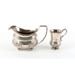 Property of a lady - a George III silver milk jug, London 1805; together with a small silver thistle