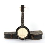 Property of a deceased estate - a cased banjo by Ebblewhite, London.