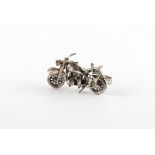 Property of a gentleman - an Italian silver articulated model of a motorbike, 2.25ins. (5.7cms.)