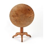 Property of a lady - a 19th century elm circular tilt-top table with tapering hexagonal column &