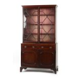 Property of a lady - an early 19th century George IV mahogany chiffonier bookcase, the top & base