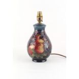 Property of a gentleman - a Moorcroft Birds & Fruit pattern table lamp, 10.5ins. (26.7cms.) high.