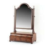 Property of a lady - a walnut swing-frame toilet mirror with stepped four drawer base, 28.5ins. (