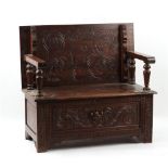 Property of a deceased estate - an early 20th century carved oak monk's bench, with box seat, 42ins.