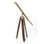 Property of a gentleman - a brass telescope on tripod stand, one nut missing to tripod.