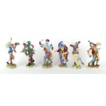 Property of a gentleman - a set of six German Volkstedt porcelain figures of dancing jesters,