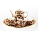 Property of a gentleman - a Royal Crown Derby imari pattern 1128 miniature tea set on tray, year