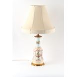 Property of a gentleman - a late 19th century French gilt metal mounted porcelain table lamp,