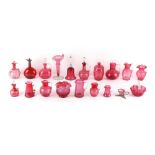 Property of a lady - a collection of nineteen cranberry glass items including wine jugs and a Jack-