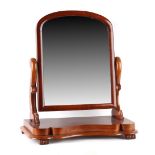 Property of a gentleman - a Victorian mahogany swing-frame toilet mirror, 28ins. (71cms.) high.
