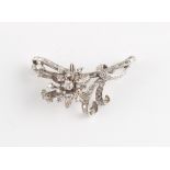 An unmarked early 20th century platinum diamond floral spray brooch, the round brilliant cut &