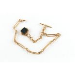 Property of a lady - an 18ct gold watch chain, with T-bar & swivel, 16.5ins. (42cms.) long,