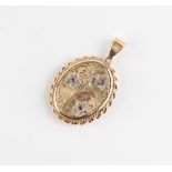 Property of a deceased estate - a 9ct gold oval pendant locket set with three round cut rubies, 43mm