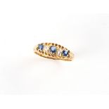 An early 20th century 18ct yellow gold sapphire & diamond five stone ring, Birmingham 1915, size M.