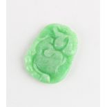 A Chinese carved jadeite pendant, 39mm long.