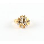 Property of a gentleman - a modern hallmarked 18ct yellow gold diamond stylised sunburst ring, the