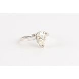 Property of a deceased estate - an 18ct white gold moissanite single stone ring, with pear shaped
