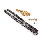Property of a deceased estate - a black pearl two row necklace; together with two gold plated