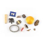 Property of a lady - a bag containing assorted items including a 9ct gold brooch with steel pin