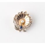 An early 20th century Belle Epoque unmarked gold sapphire diamond & pearl stylised peacock brooch,