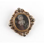 Property of a lady - a Victorian unmarked gold & black enamel framed mourning brooch, with