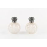 Property of a deceased estate - a pair of Victorian silver topped cut glass globe scent bottles with
