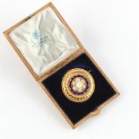 Property of a deceased estate - a Victorian unmarked yellow gold (tests 15ct) & blue enamel circular