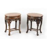 Property of a lady - a pair of Chinese carved hongmu oval stands or occasional tables, late 19th /