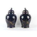 Property of a lady - a pair of Chinese powder blue ground baluster vases & covers, Kangxi period (