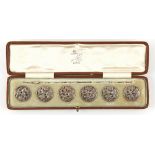 The Henry & Tricia Byrom Collection - an Edwardian cased set of six silver buttons, of pierced