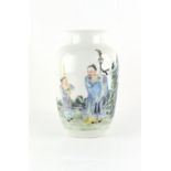 A Chinese famille rose porcelain vase, painted with a man and boy standing by rockwork, red